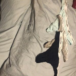 Three Calvin Klein thongs